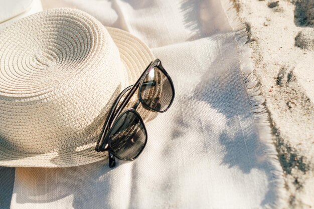 Straw beach hat with brim for sun protection with glasses