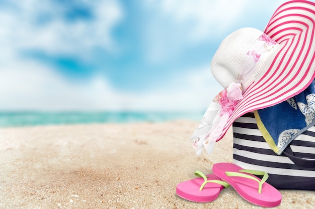 straw hat and  basket for beach