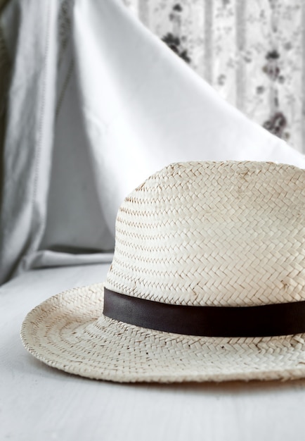 Straw hat on white table