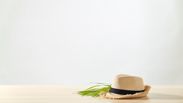 Straw hats are placed on a wooden table