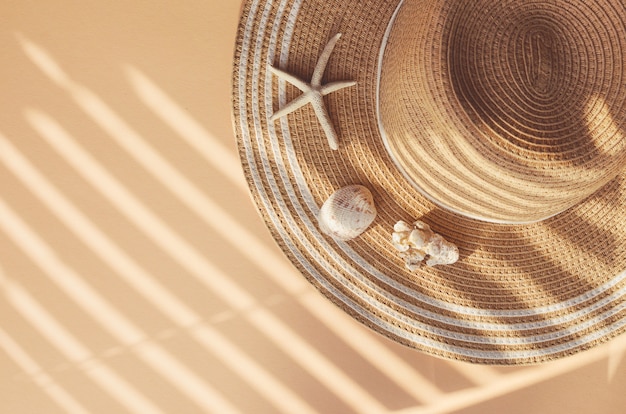 Straw summer hat with seashells and corals