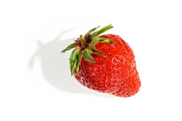 Strawberrie with a shadow on white