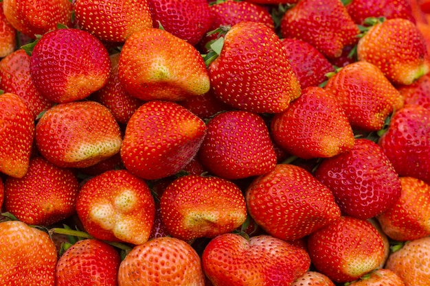 Strawberries background Intense red color