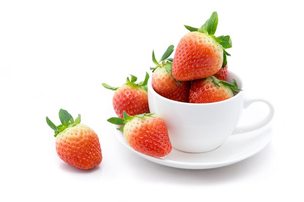 Photo strawberries in a coffie cup isolated on white