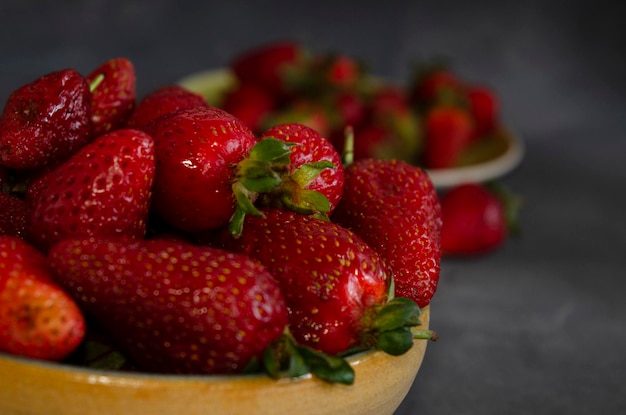 strawberries in fresh fruit closeup with gray background