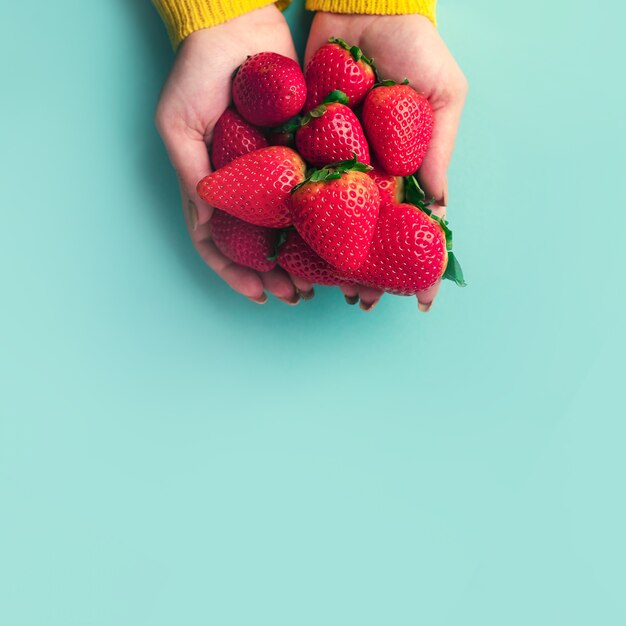 Strawberries in hands