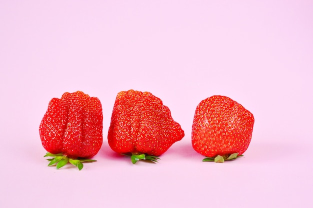 Strawberries isolated on pink