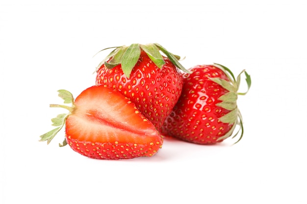 Strawberries isolated on white surface. Summer sweet fruits and berries