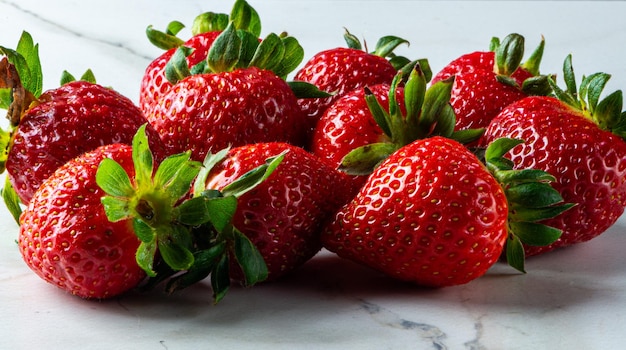 Strawberries on marbled background on gray background