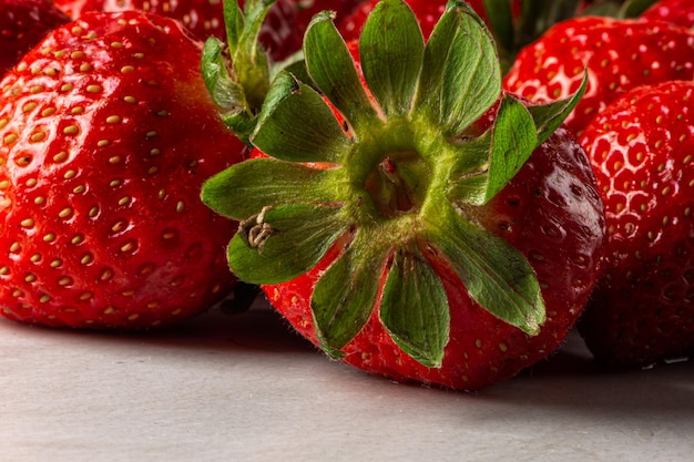 Strawberries on marbled background on gray background