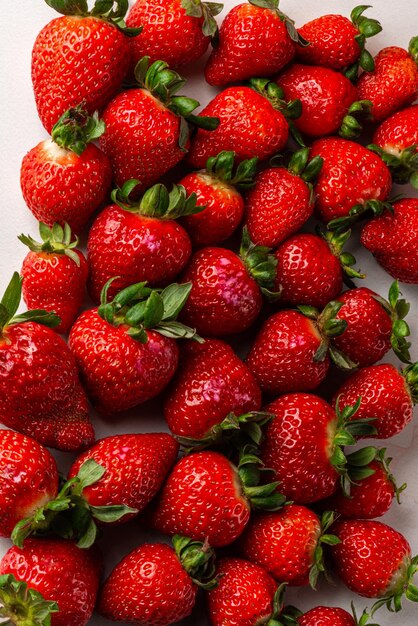 Strawberries on marbled background on gray background