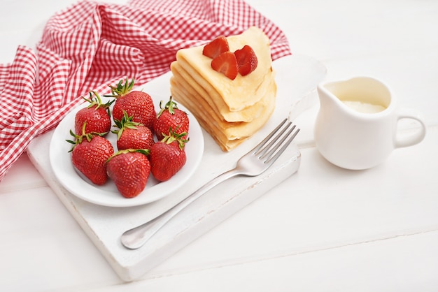 Strawberries and pancakes. Maslenitsa. Pancake week.