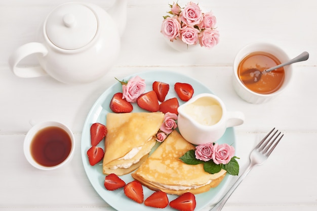 Strawberries and pancakes. Maslenitsa. Pancake week.