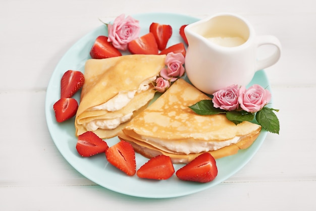 Strawberries and pancakes. Maslenitsa. Pancake week.