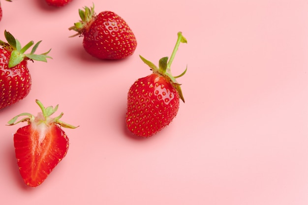 Strawberries on pink background