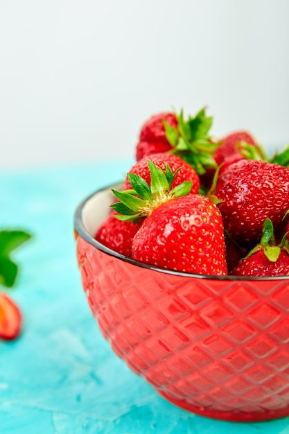 Strawberries in red bowl. Fresh strawberries. Beautiful strawberries.