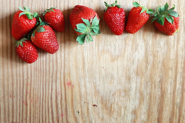 Strawberries top on wooden background