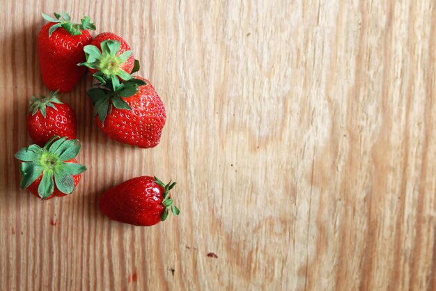 Strawberries top on wooden background