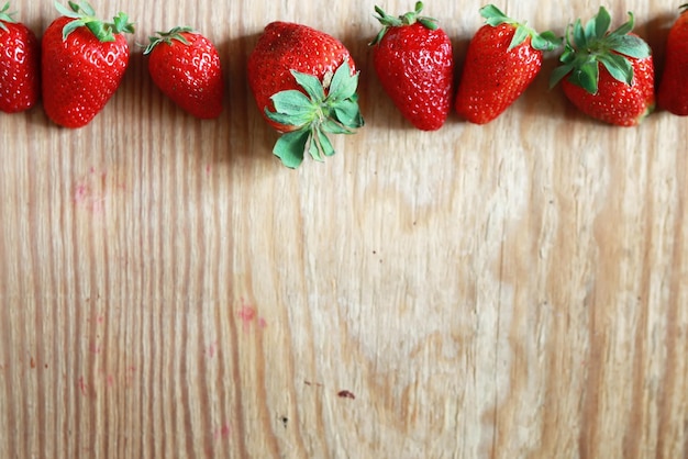 Strawberries top on wooden background