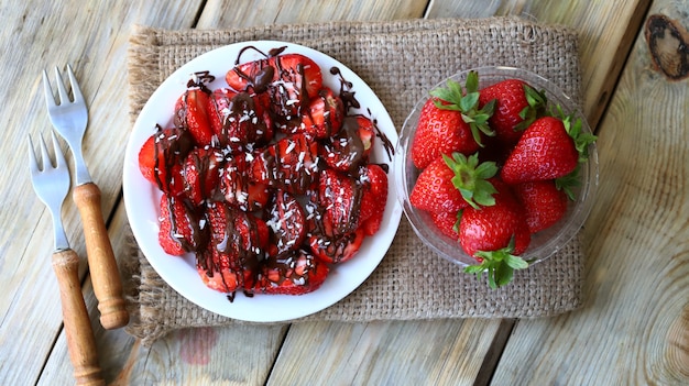 Strawberries with chocolate on a plate