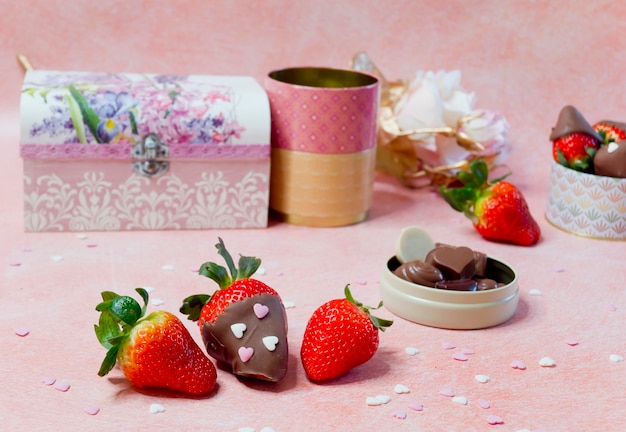 Strawberries with chocolate and without chocolate with other background objects