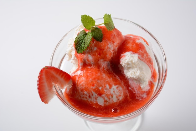 Strawberries with ice cream in glass cup Summer dessert