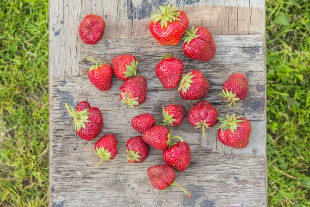 Strawberries on a wooden board vintage