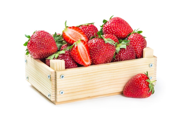 Strawberries in wooden box isolated on white background