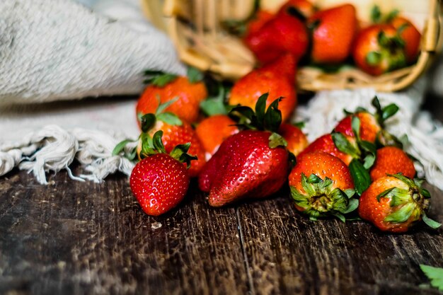 Strawberry basket deluxe strawberry in basket on wooden background 