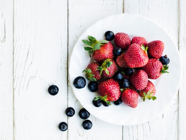 Strawberry and blueberry on plate