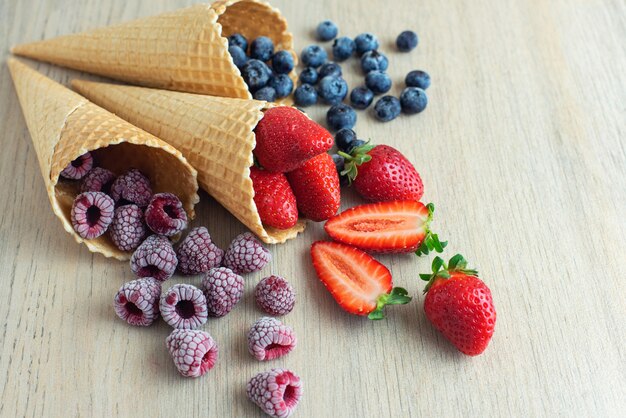 Strawberry, blueberry, raspberry in waffle cones