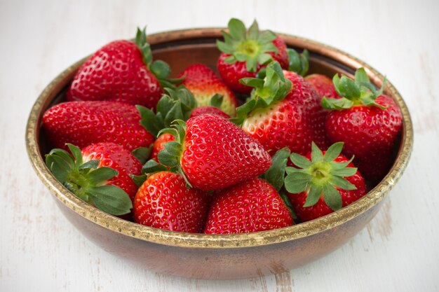 Strawberry in the bowl on table