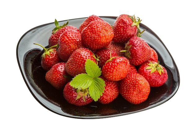 Strawberry in the bowl with leaf