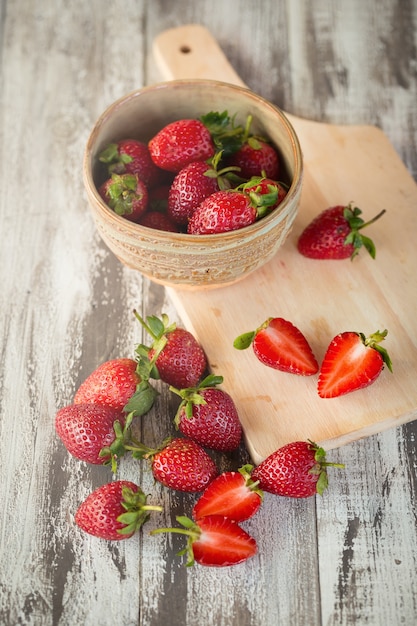 Strawberry In a bowl On a Wooden Background