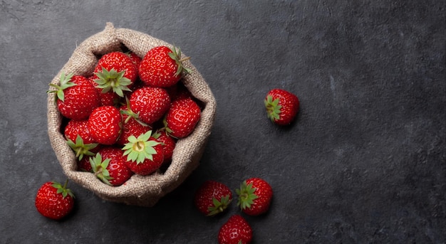 Strawberry burlap bag with ripe garden berries