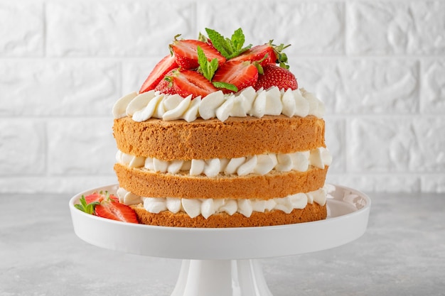 Strawberry cake vanilla sponge cake with cream cheese and fresh strawberries Summer cake