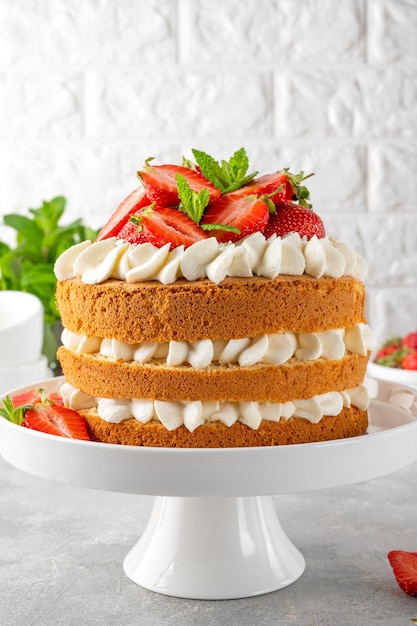 Strawberry cake vanilla sponge cake with cream cheese and fresh strawberries Summer cake