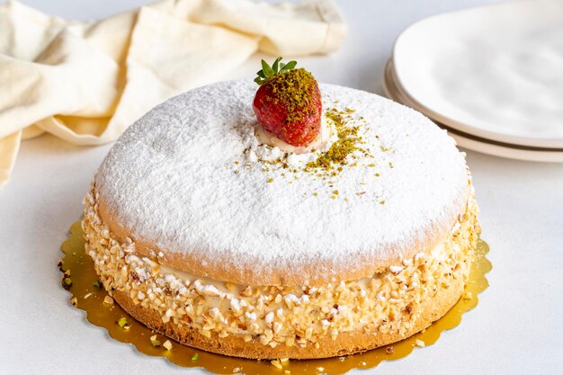 Strawberry cake on a white background German cake filled with cream and strawberries