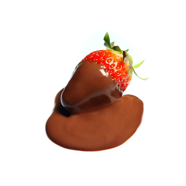 a strawberry in chocolate over white background