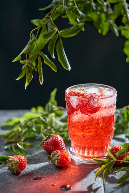 Strawberry cocktail on a grey background