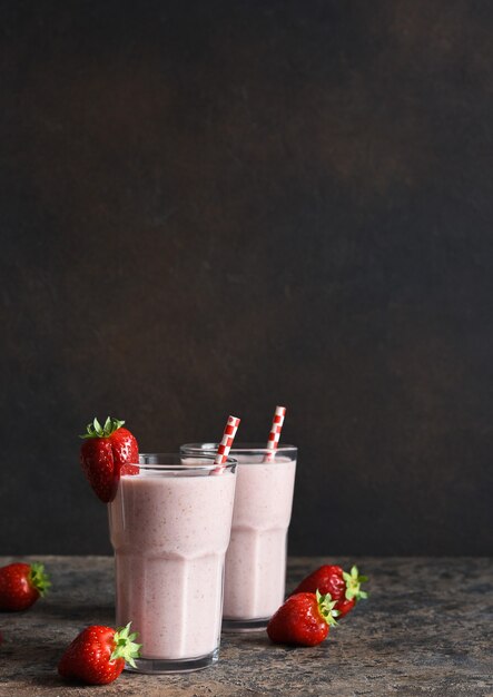 Strawberry cocktail - a milkshake with ice cream and milk. Strawberry smoothie for breakfast.