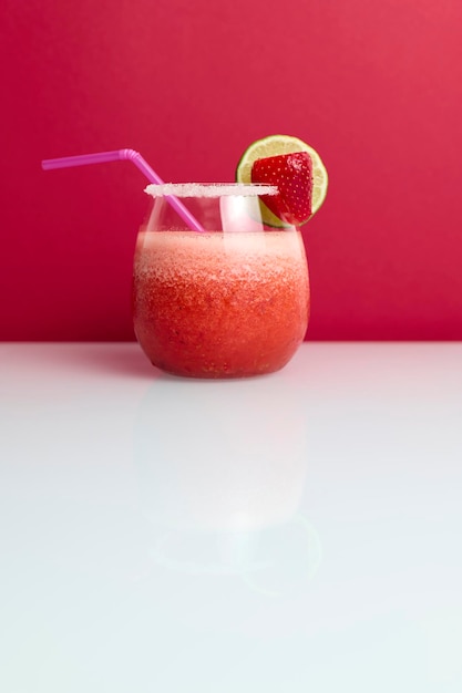 Strawberry cocktail with drinking straw