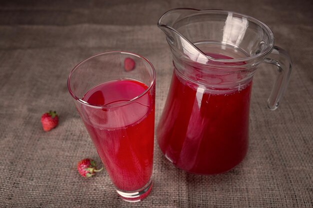 Strawberry compote in a glass on burlap