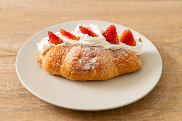 Strawberry fresh cream croissant on plate