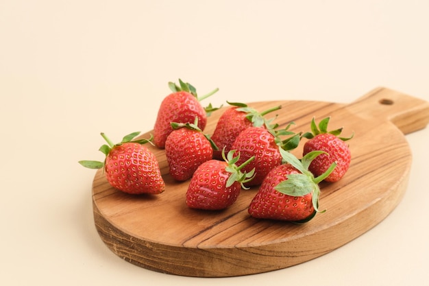 Strawberry fresh juicy strawberries with leaves served on chopping board Selected focus