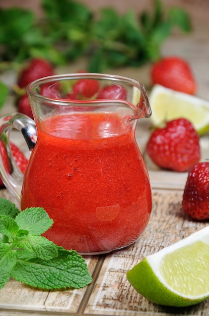 Strawberry fresh sauce with mint and lime Vertical shot