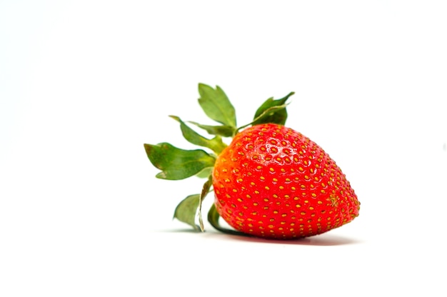 Strawberry fruit closeup isolated on white