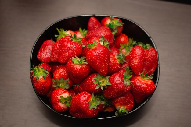 Strawberry fruit red spring fresh plate black