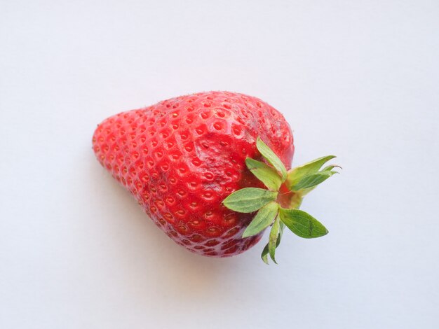 Strawberry fruit over white background