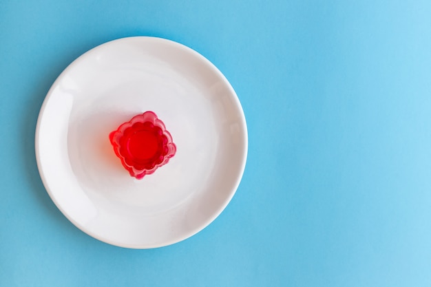 Strawberry gelatin on a white plate